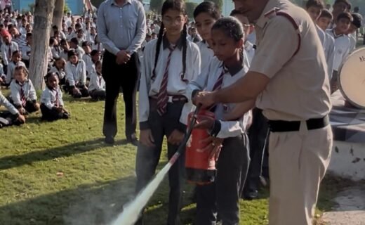 Fire safety mock drill conducted by the Fire Department at Samsara Public School, Shekhukheda; students shown fire-extinguishing techniques.